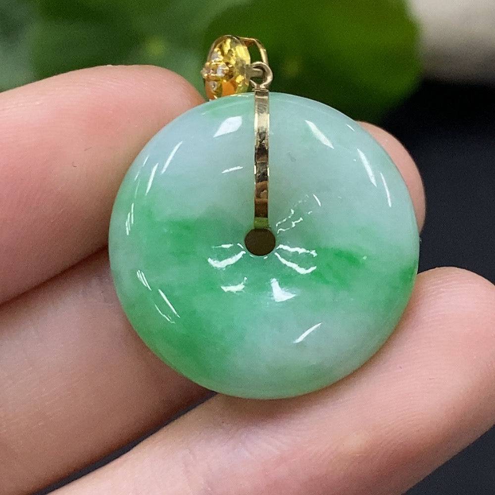 Jadeite safety buckle pendant with 18K gold and diamond accents, featuring a smooth jade surface and intricate design.