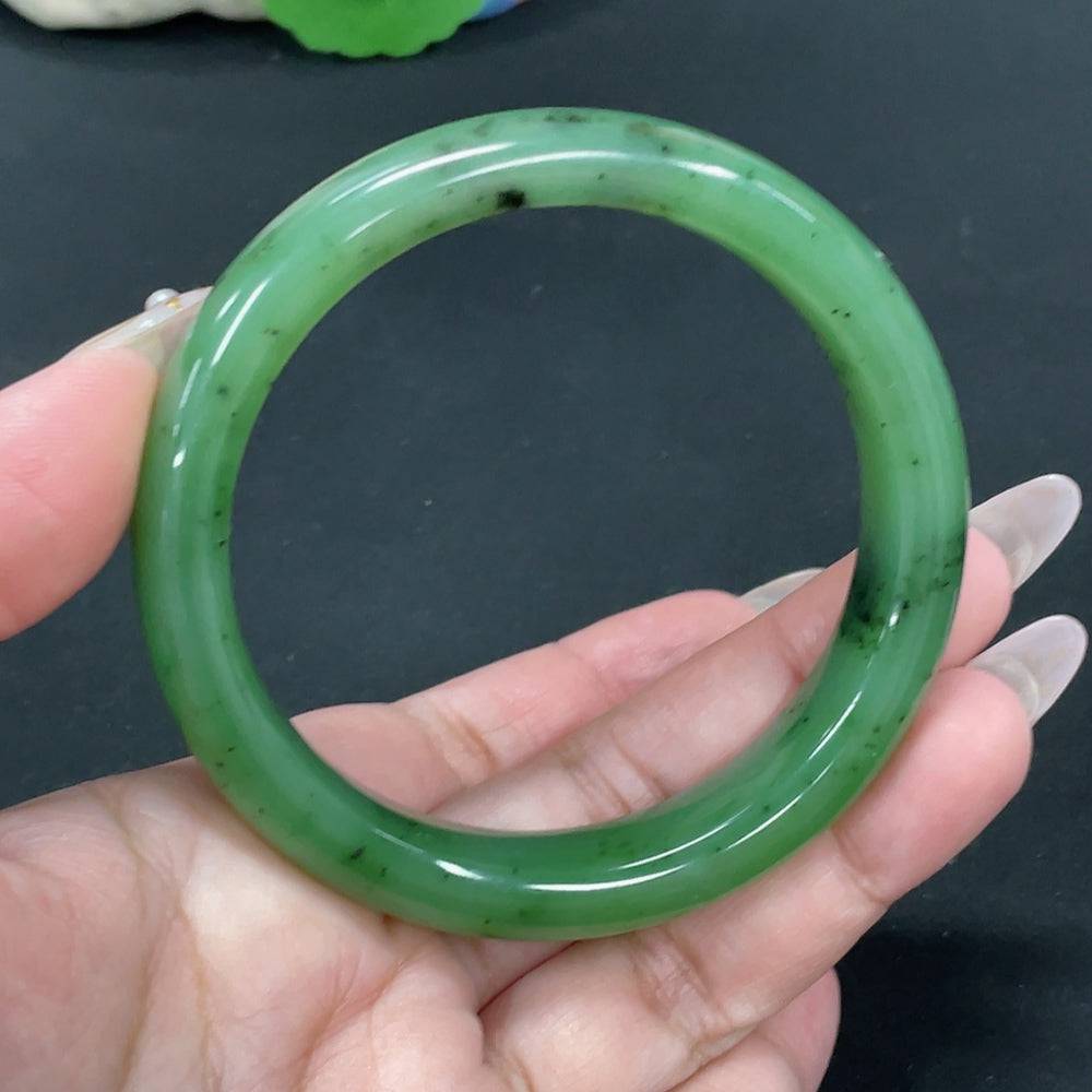 Huiliu certified Hetian jade round bracelet featuring smooth, polished jade beads on a delicate string.