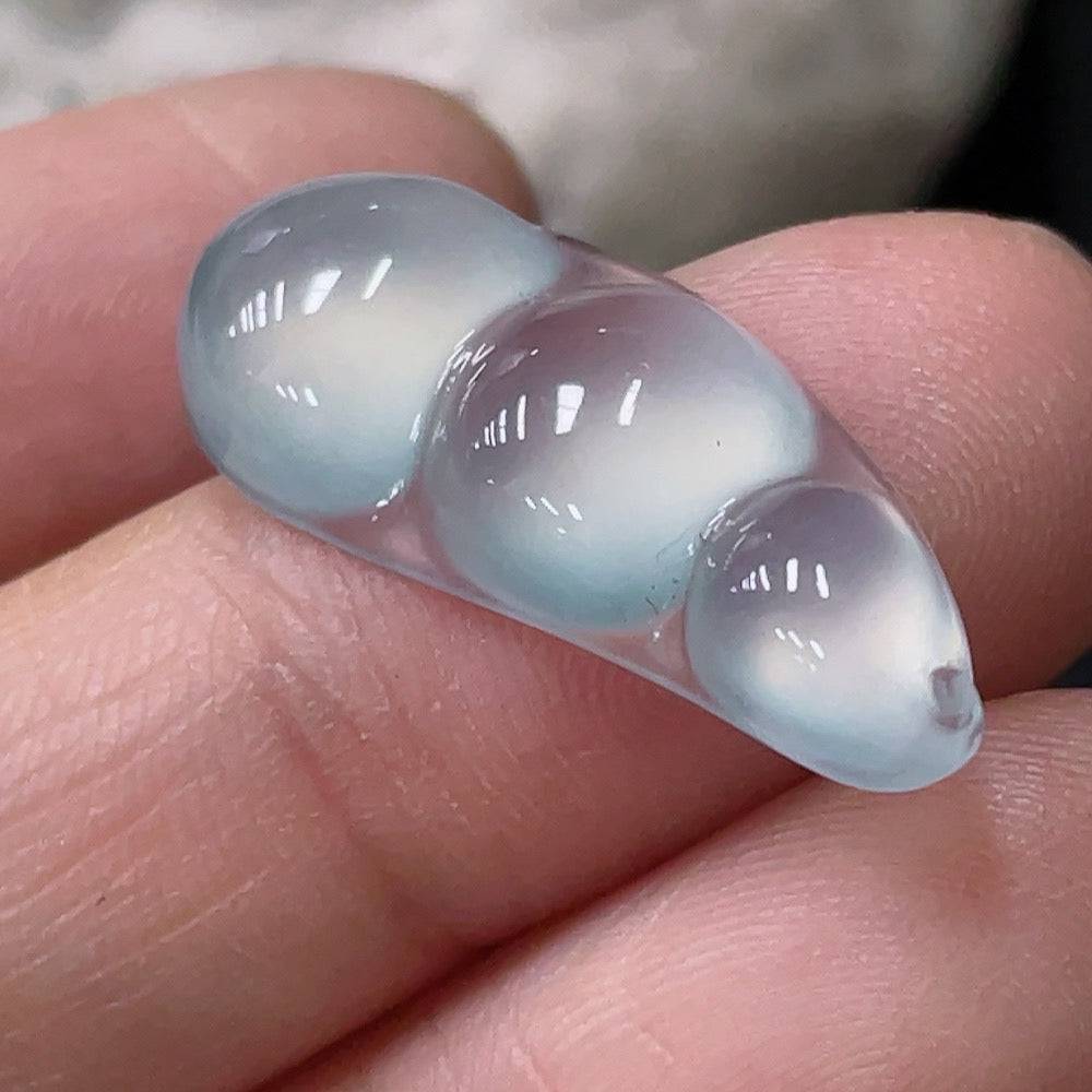 Jadeite inlaid pendant with lucky beans, crafted by HUILIU HQ, weighing approximately 1.86g, featuring intricate jade design.