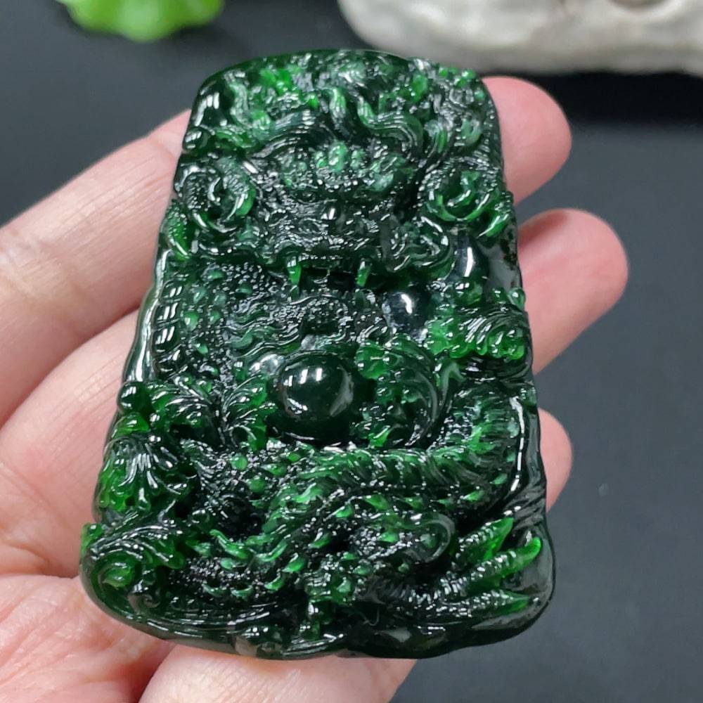 Jadeite dragon pendant weighing approximately 40g, crafted from jade, featuring detailed dragon design, by HUILIU HQ.
