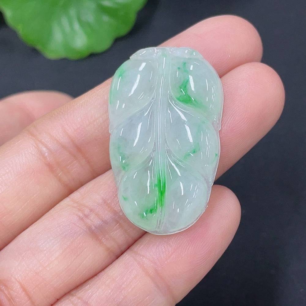 Huiliu certified jadeite pendant shaped like a leaf, showcasing smooth green jade with natural beauty and intricate leaf details.