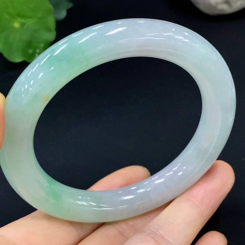 Huiliu Certified Jadeite round bangle featuring smooth, polished jade with a natural green hue, traditional jewelry style.