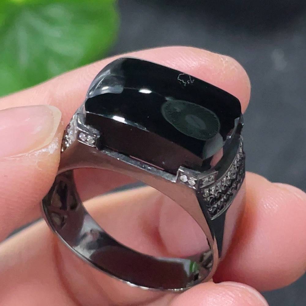 Huiliu jadeite ring with diamond accents, featuring a polished jade gemstone and intricate design, on a neutral background.