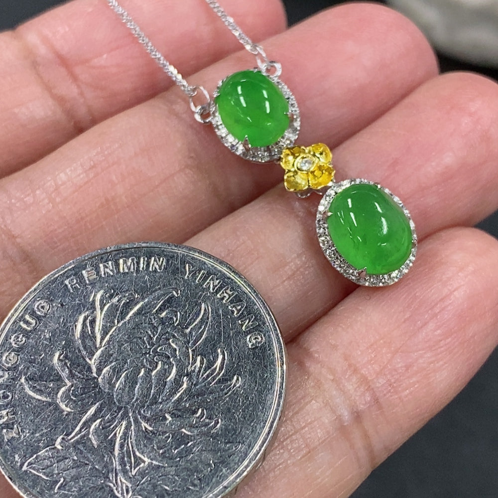 Jadeite cabochon pendant necklace with 18K gold setting and diamond accents, weight approx. 2.64g, by HKHQ.