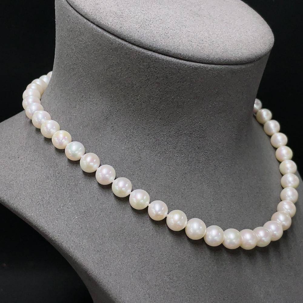 HUILIU HQ pearl necklace with suspected plated pearls, featuring a delicate strand of lustrous white pearls on a jewelry display.