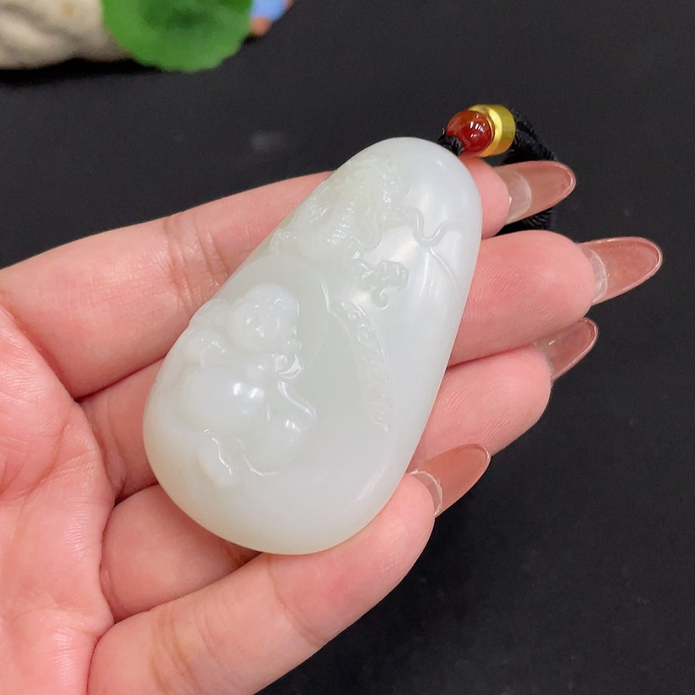 Huiliu Hetian jade Buddha pendant with rope, showcasing smooth, polished green jade carved as a serene Buddha figure.