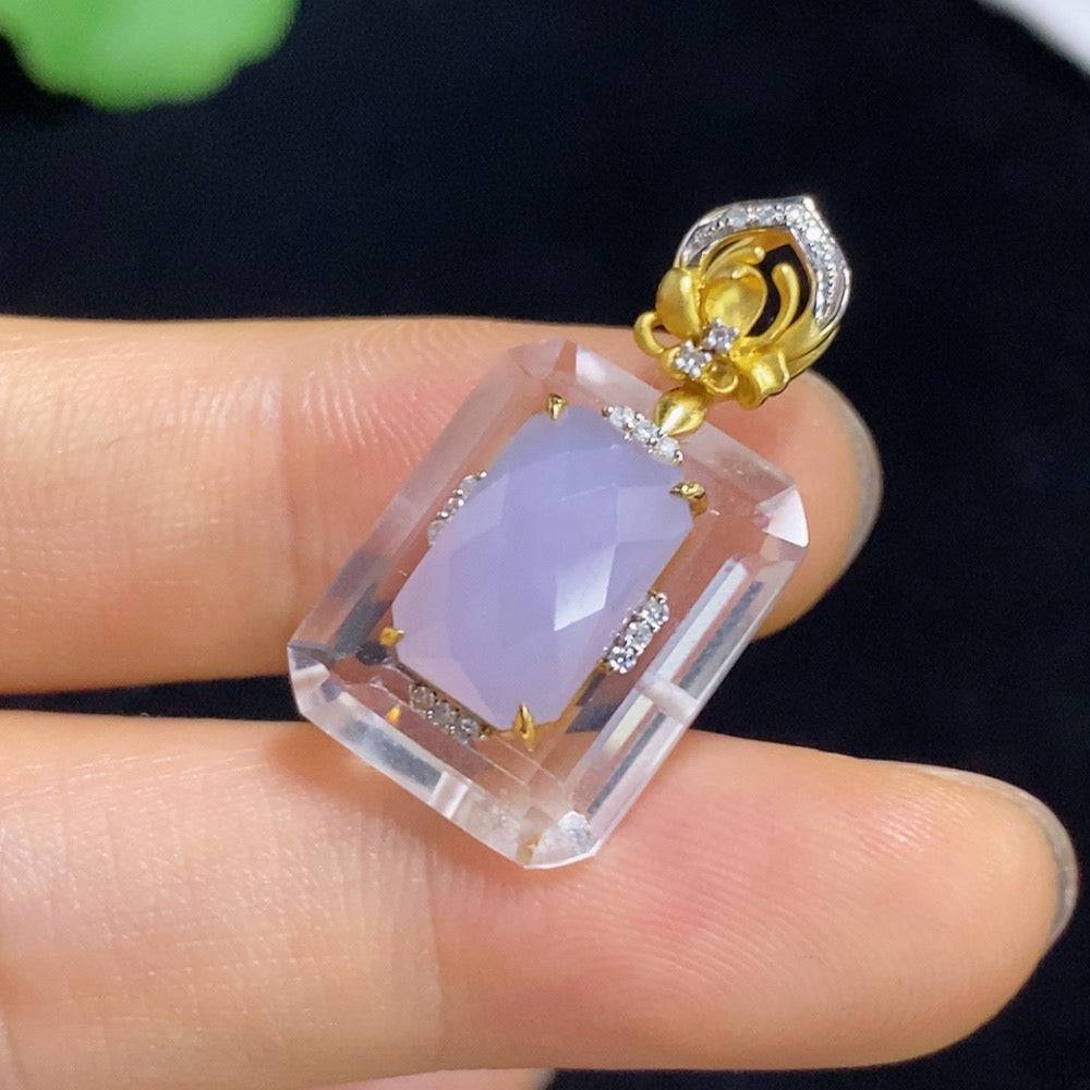 Jadeite pendant with 18k gold and diamond accents, featuring a polished jade stone and intricate gold detailing.