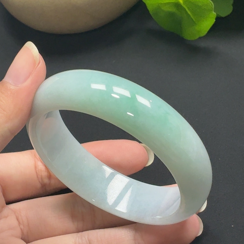 HKHQ jadeite round bangle, size 56.8, with a total weight of 69.51g, showcasing smooth, polished green jade jewelry.