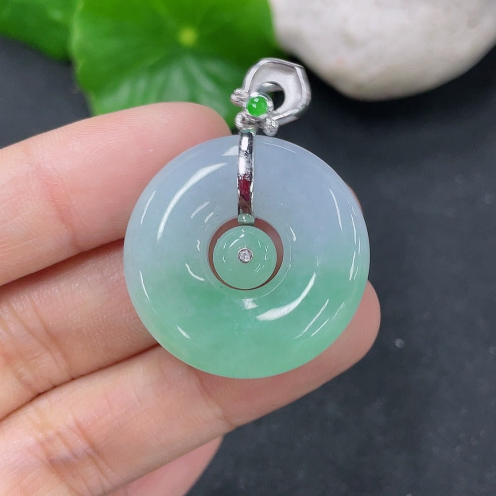 Jadeite pendant featuring a mother-and-child buckle design, crafted by HKHQ, weighing approximately 9.69g.
