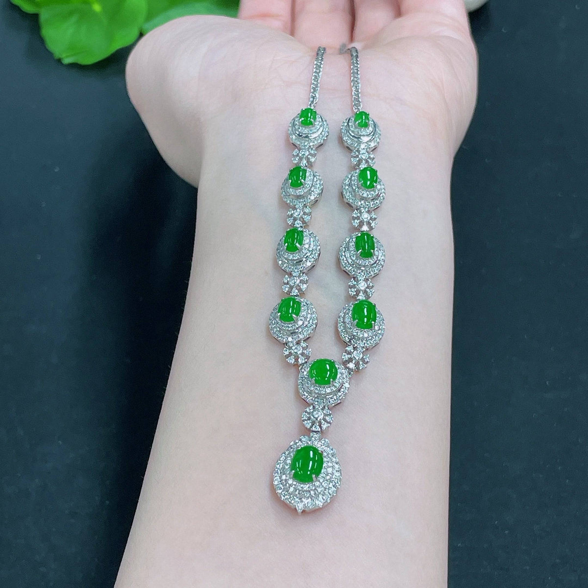 Huiliu Jadeite necklace set with diamonds, featuring elegant jade jewelry with sparkling diamond accents on a white background.