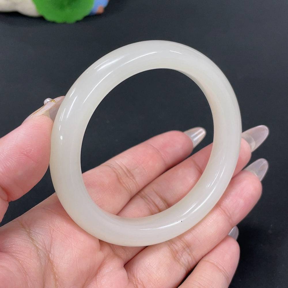Huiliu certified Hetian jade round bracelet featuring smooth, polished jade beads on a delicate string.