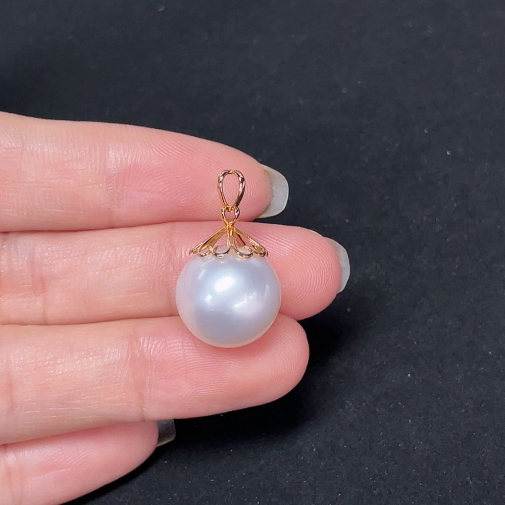 Seawater pearl pendant on 18K gold chain, about 13.7mm, from HKHQ, showcasing a lustrous pearl with gold setting.