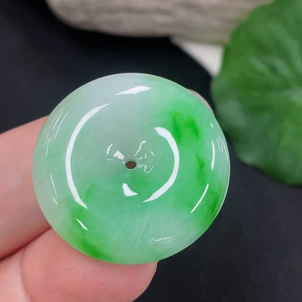 Jadeite Peace Knot pendant from HUILIU HQ, showcasing a smooth, polished jade jade pendant with intricate knot design.