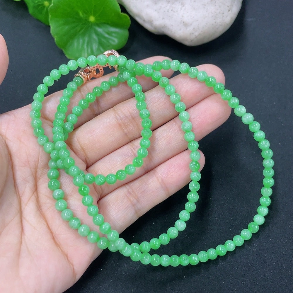 Jadeite bead necklace by HKHQ featuring smooth, green jadeite beads, weighs 17.87g, showcasing elegant jewelry design