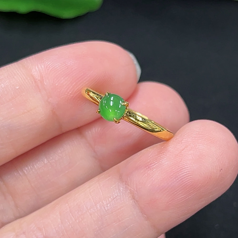 Elegant jadeite inlaid ring with 18K gold setting, featuring intricate HKHQ jewelry design, close-up of the detailed craftsmanship.
