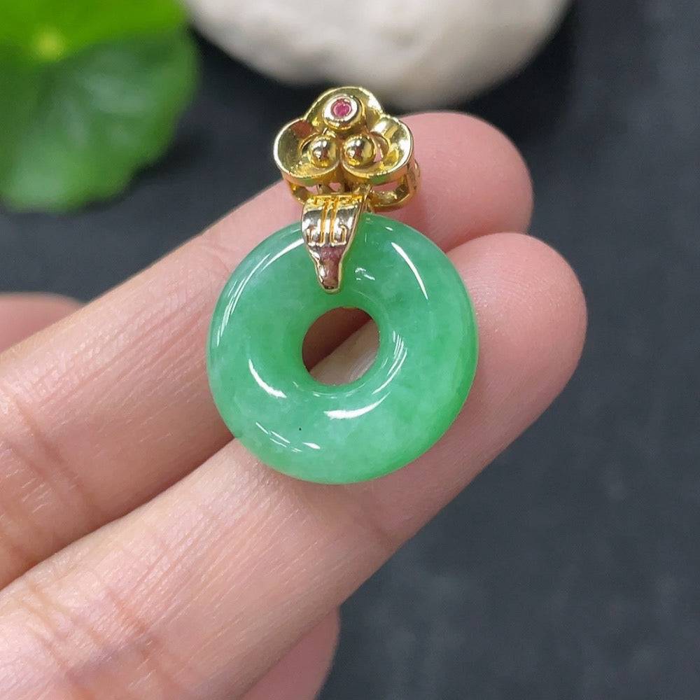 Huiliu Jadeite pendant donut with suspected plating, featuring a smooth, polished jade surface and intricate craftsmanship.