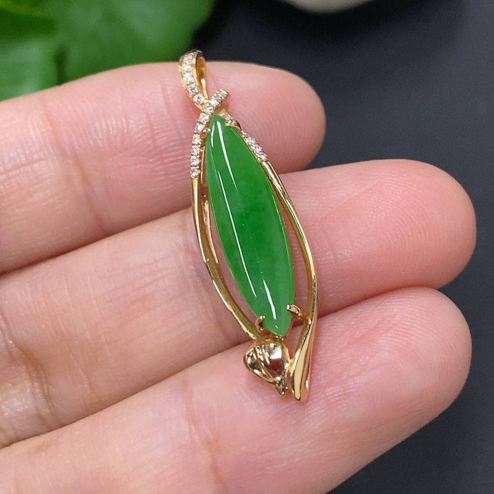 Jadeite pendant with diamond accents in 18K gold mount, featuring a smooth green jade stone, weight approx. 2.5g.