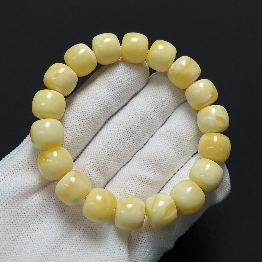 Amber beeswax bracelet from HKHQ featuring a natural, warm amber color and handcrafted design, weighing approximately 19.71 grams.