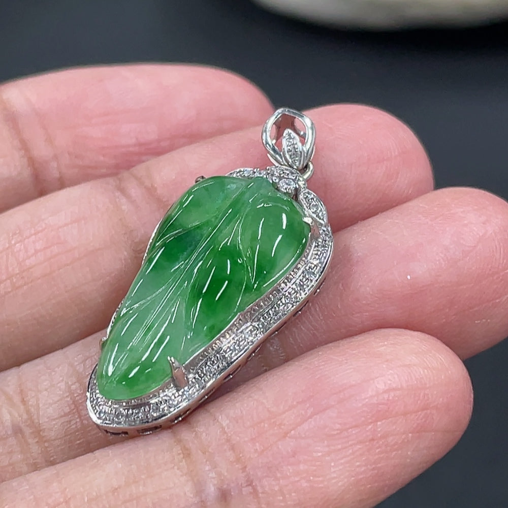Jadeite leaf inlay pendant with 18k gold and diamond accents, weighing about 3g, from HKHQ.