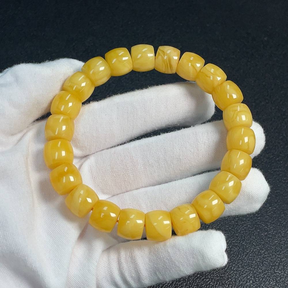 Huiliu Amber Beeswax Bracelet with 11.2mm beads, natural amber jewelry, certified by Huiliu, featuring warm honey-toned beads.