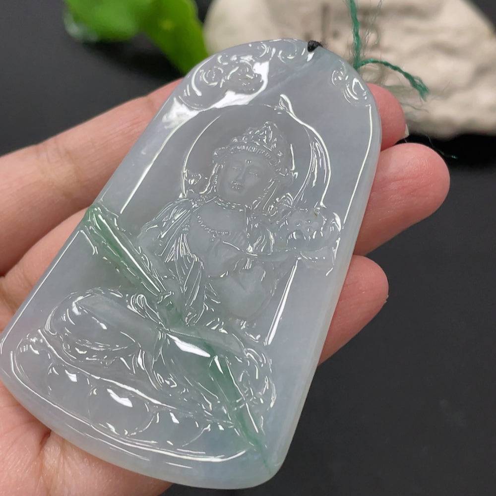 Jadeite Guanyin pendant in green jade, carved by HUILIU HQ, weighing approximately 51.47g, featuring detailed religious figure design.