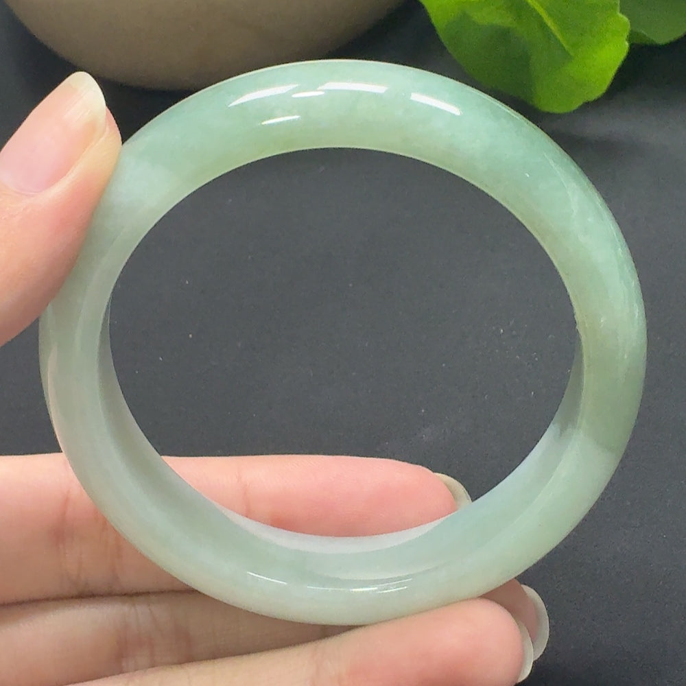 Jadeite round bangle with size 55.6 and weight 60.26g, featuring smooth, polished jadeite from HKHQ.