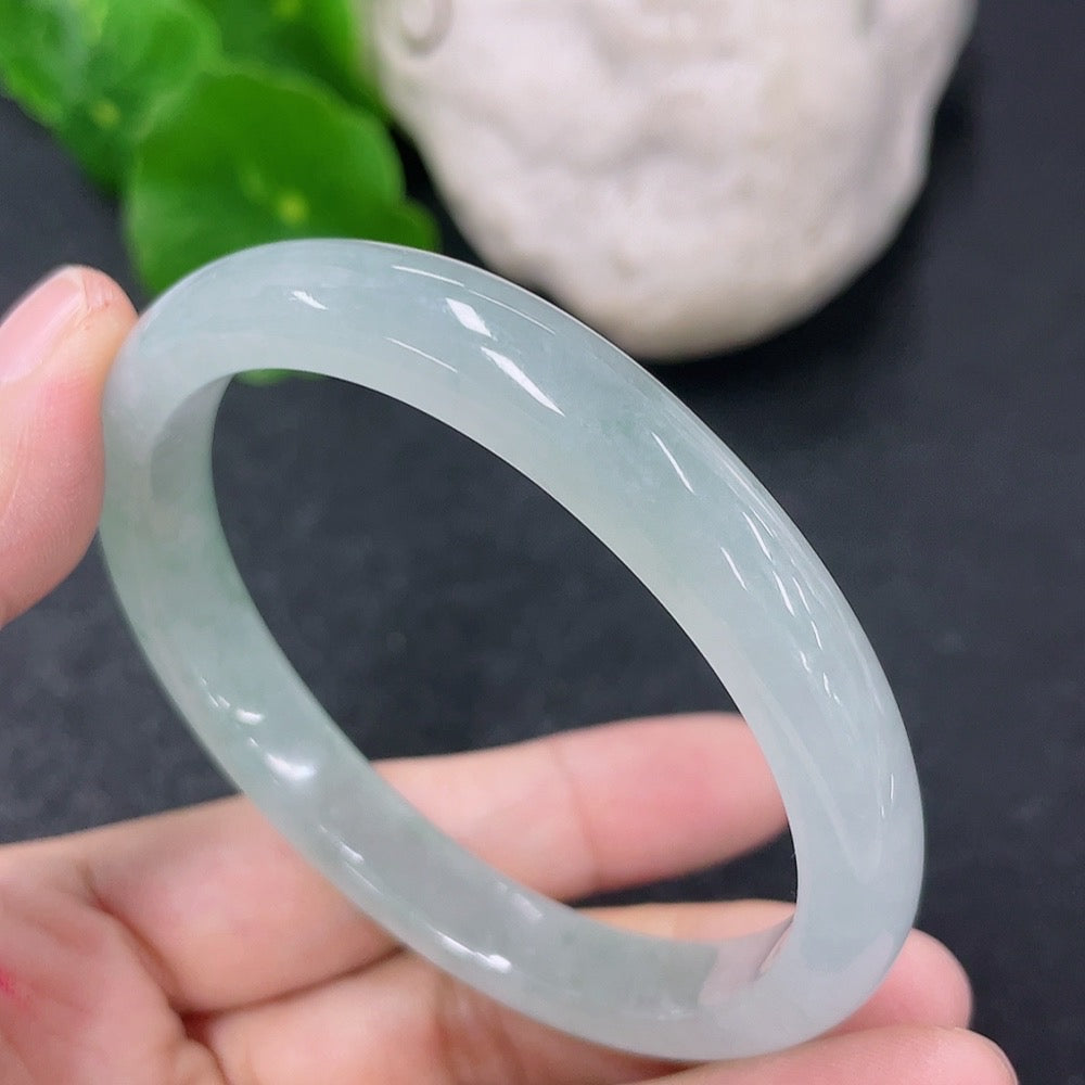 HKHQ jadeite oval bangle in size 52.8, weighing 27.69g, featuring smooth, polished jadeite with a classic oval shape.