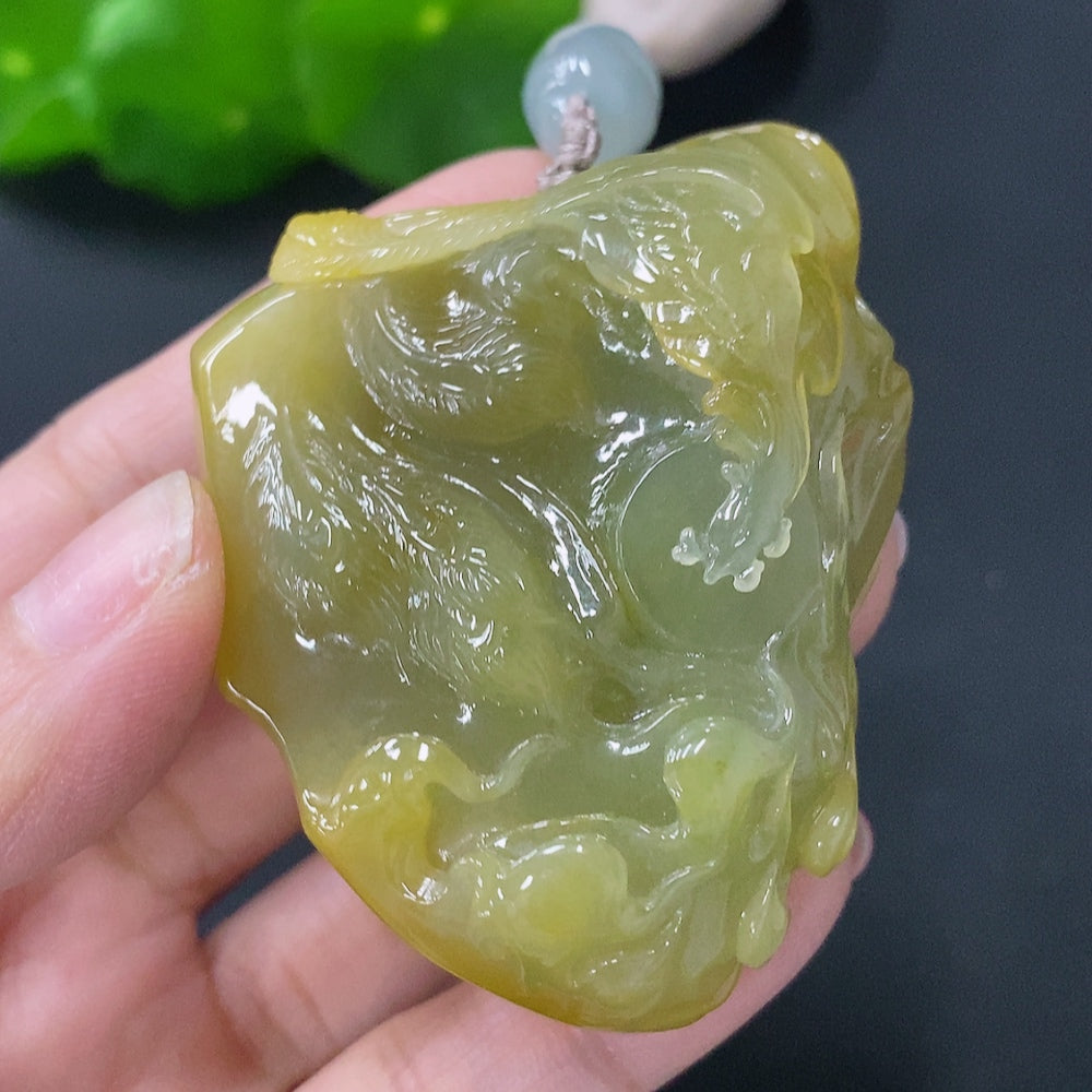 Jadeite pendant in the shape of a phoenix, approximately 81g with rope, showcasing vibrant green jade from HUILIU HQ.