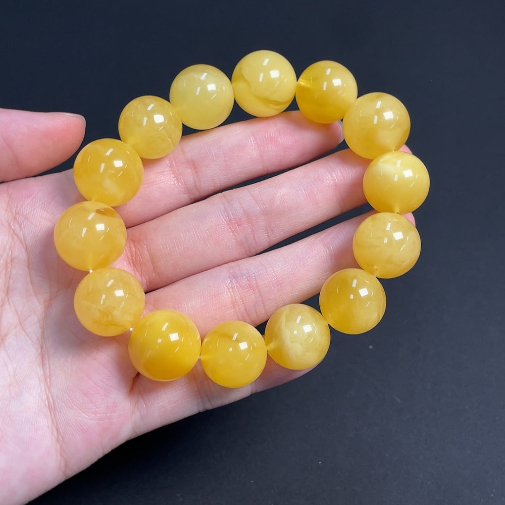 Huiliu Amber Beeswax Bracelet with 15.5mm beads, natural amber jewelry, certified HUILIU HQ bracelet showing smooth, warm-toned beads.