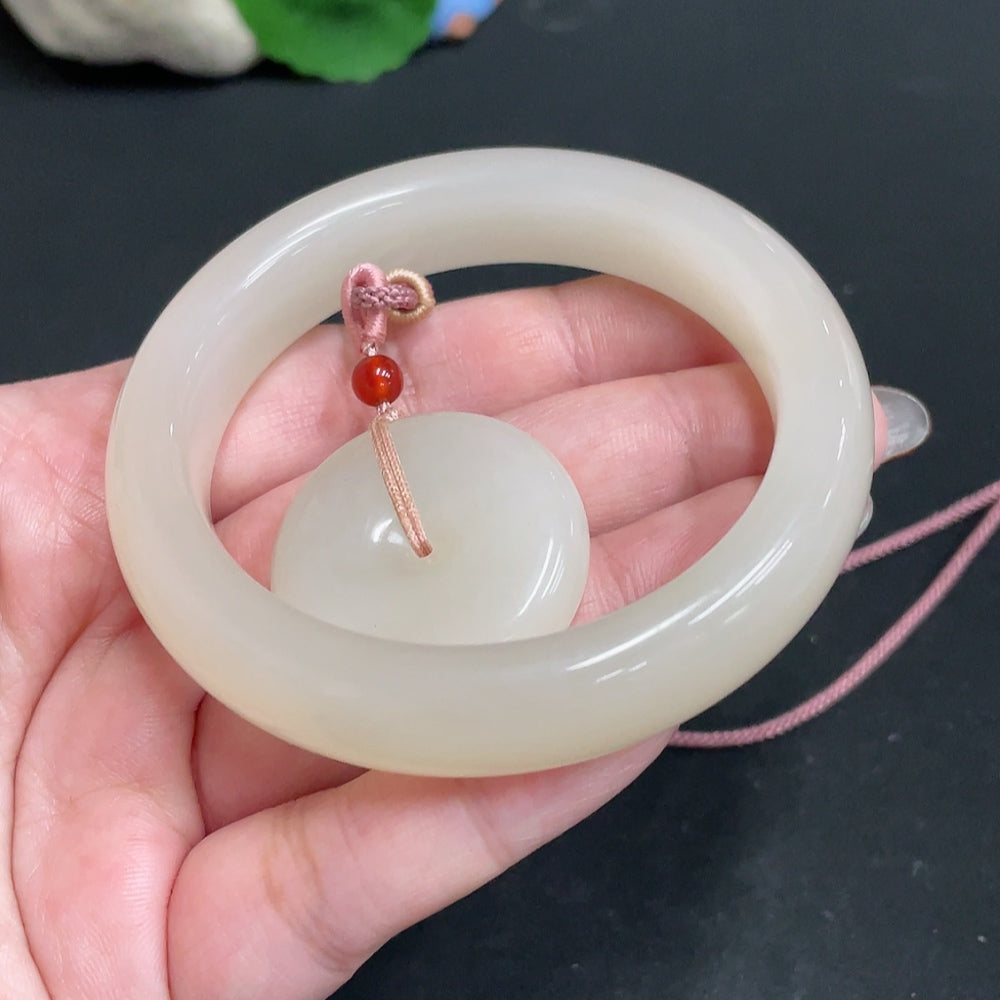 Hetian jade pendant and regular circle bracelet from HUILIU HQ, showcasing polished green jade jewelry with intricate designs.