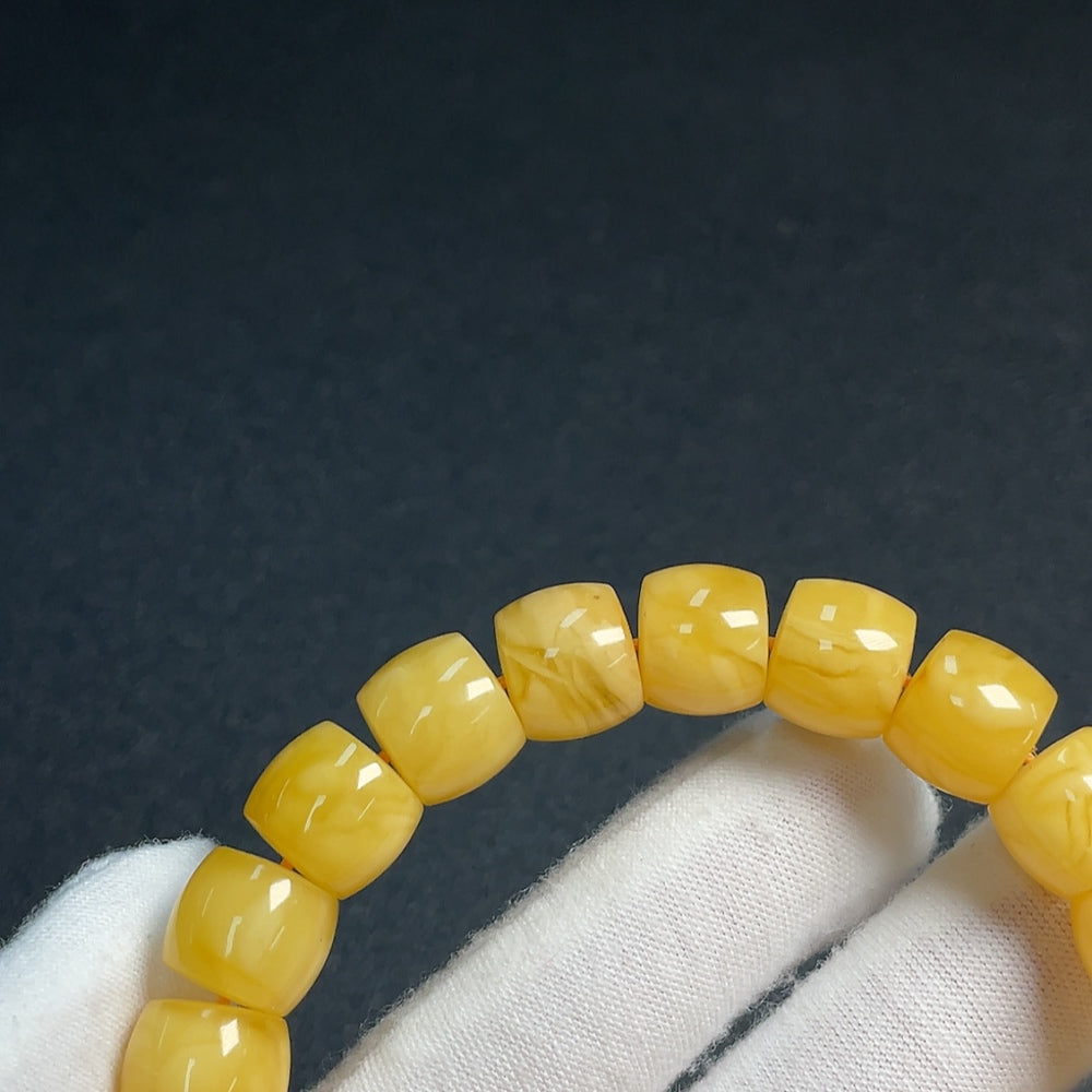 Huiliu Amber Beeswax Bracelet with 11.2mm size beads, natural amber jewelry featuring warm honey tones and handcrafted design.