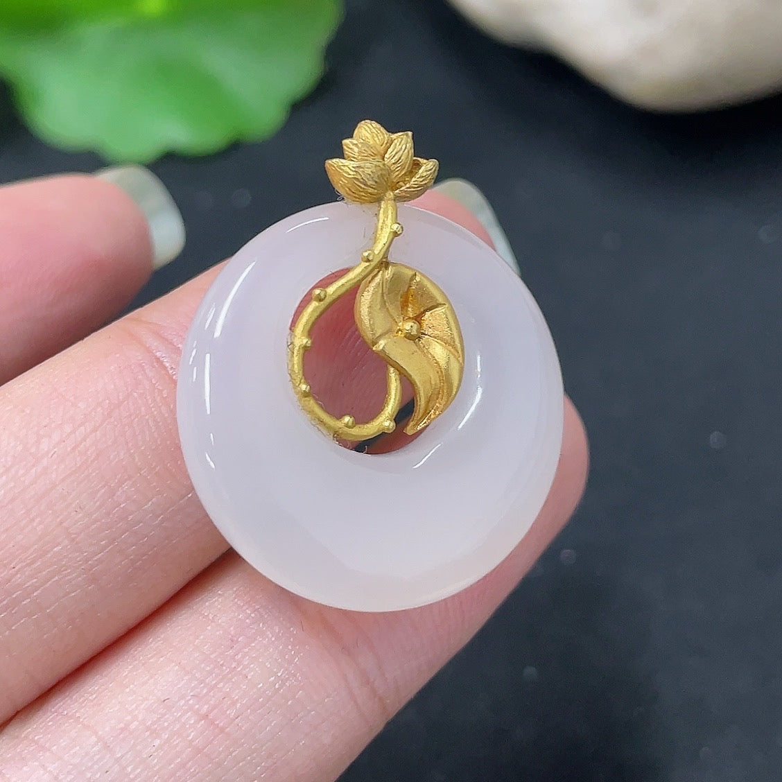 Hetian jade inlaid pendant necklace with 18K gold setting, crafted by HKHQ, featuring a smooth, polished jade stone.