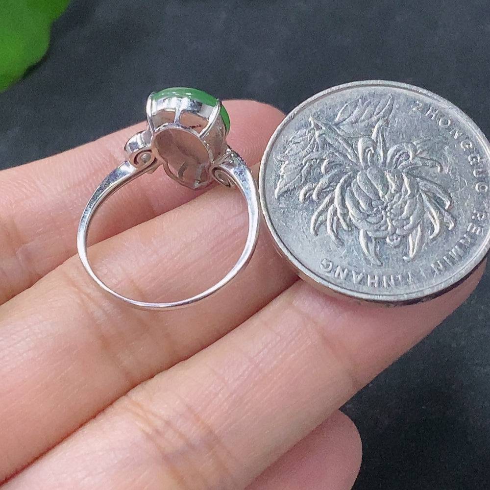 Huiliu Jadeite inlaid ring with diamond accents, featuring intricate craftsmanship and elegant design in a close-up image.