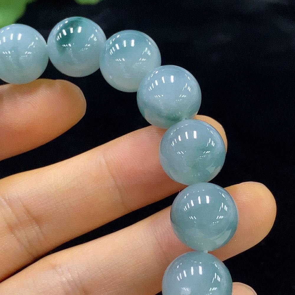 Jadeite bracelet with 12.5mm beads, crafted from green jade, showing smooth, polished beads with a total weight of 54.9g.
