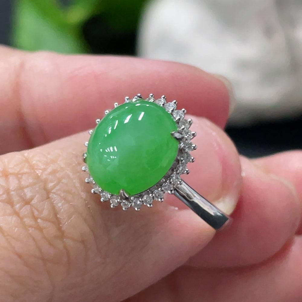 Huiliu Jadeite cabochon ring with diamond accents, showcasing smooth green jade stone and intricate band design.