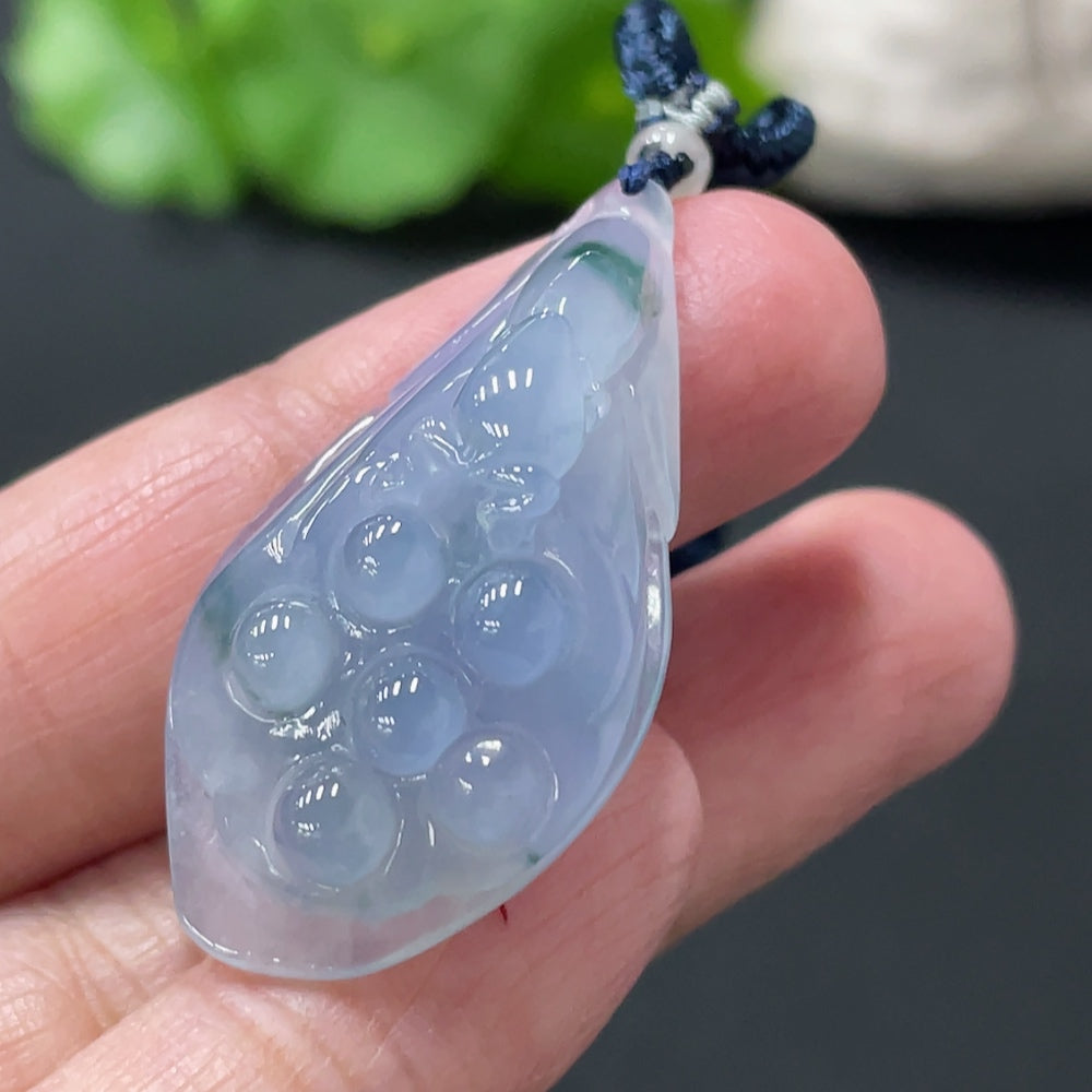 Jadeite lotus pod pendant from HUILIU HQ, crafted from green jade with detailed lotus flower design, weighs approximately 9.33g.