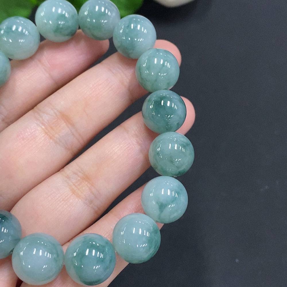 Huiliu certified jadeite bead necklace with 12.4mm smooth, polished green jade beads, natural and elegant jewelry piece.