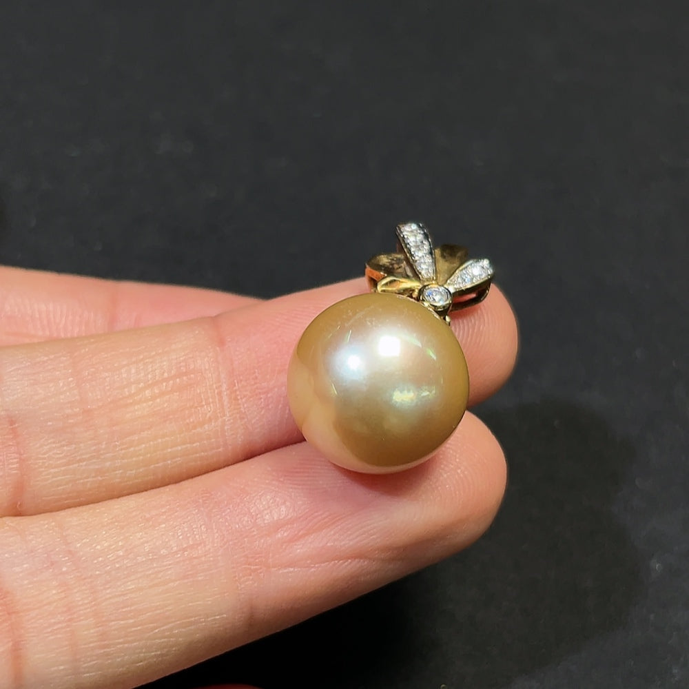 Seawater pearl pendant with 18K gold and diamond accents, about 13.8mm, featuring natural-colored pearl and delicate chain.