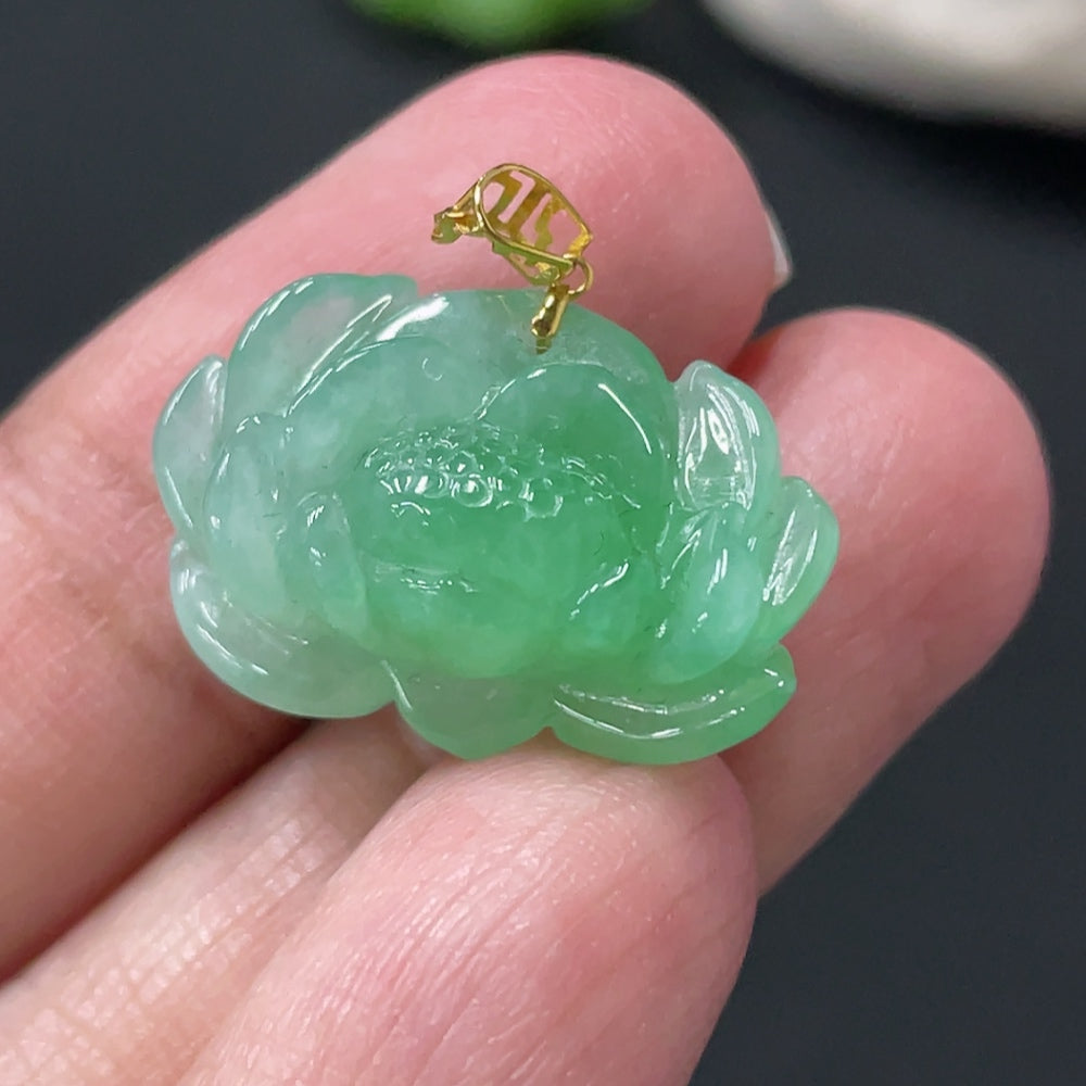Jadeite lotus pendant with 18k gold clasp, weighs approximately 3.38g, featuring intricate lotus flower design.