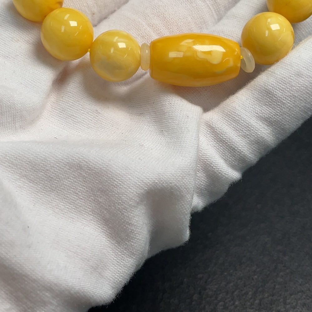 Huiliu Amber Beeswax bracelet with 11.5mm beads, natural amber jewelry featuring warm honey-colored beads and smooth round shape.