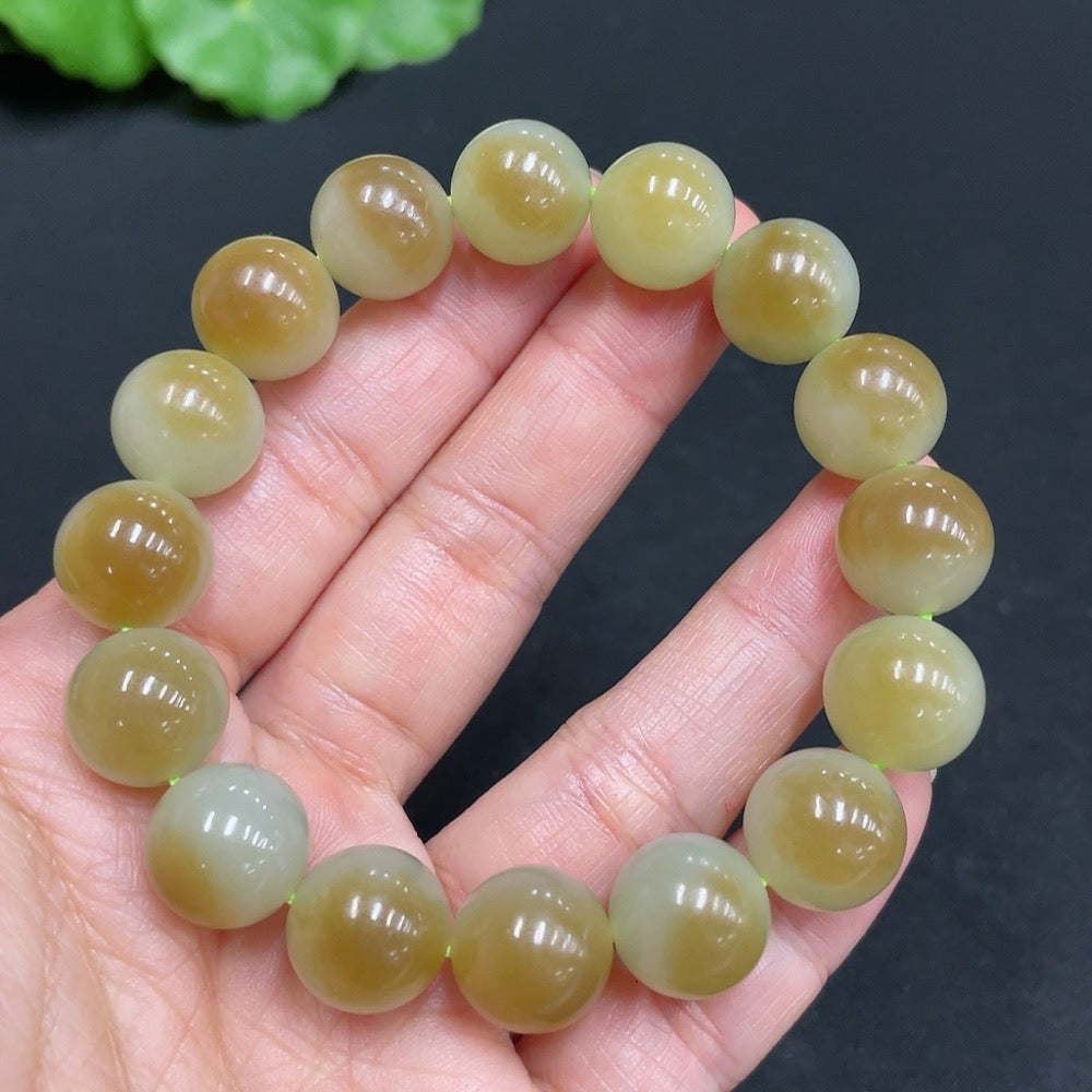 Hetian Jade bracelet with 11.9mm beads, crafted by HUILIU HQ, showcasing smooth, polished green jade stones.