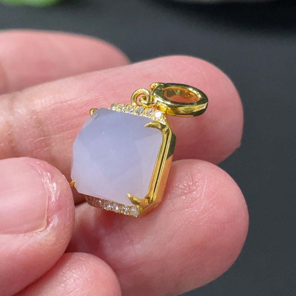 Huiliu Jadeite pendant with mount accented by diamonds, showcasing a polished green jade gemstone with elegant craftsmanship.