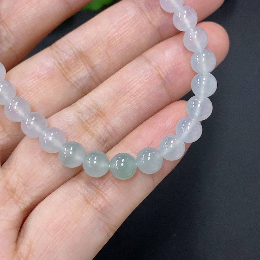 Jadeite bead necklace with 5.8mm jade beads, weighing approximately 11.3g, featuring smooth, polished green jade stones.