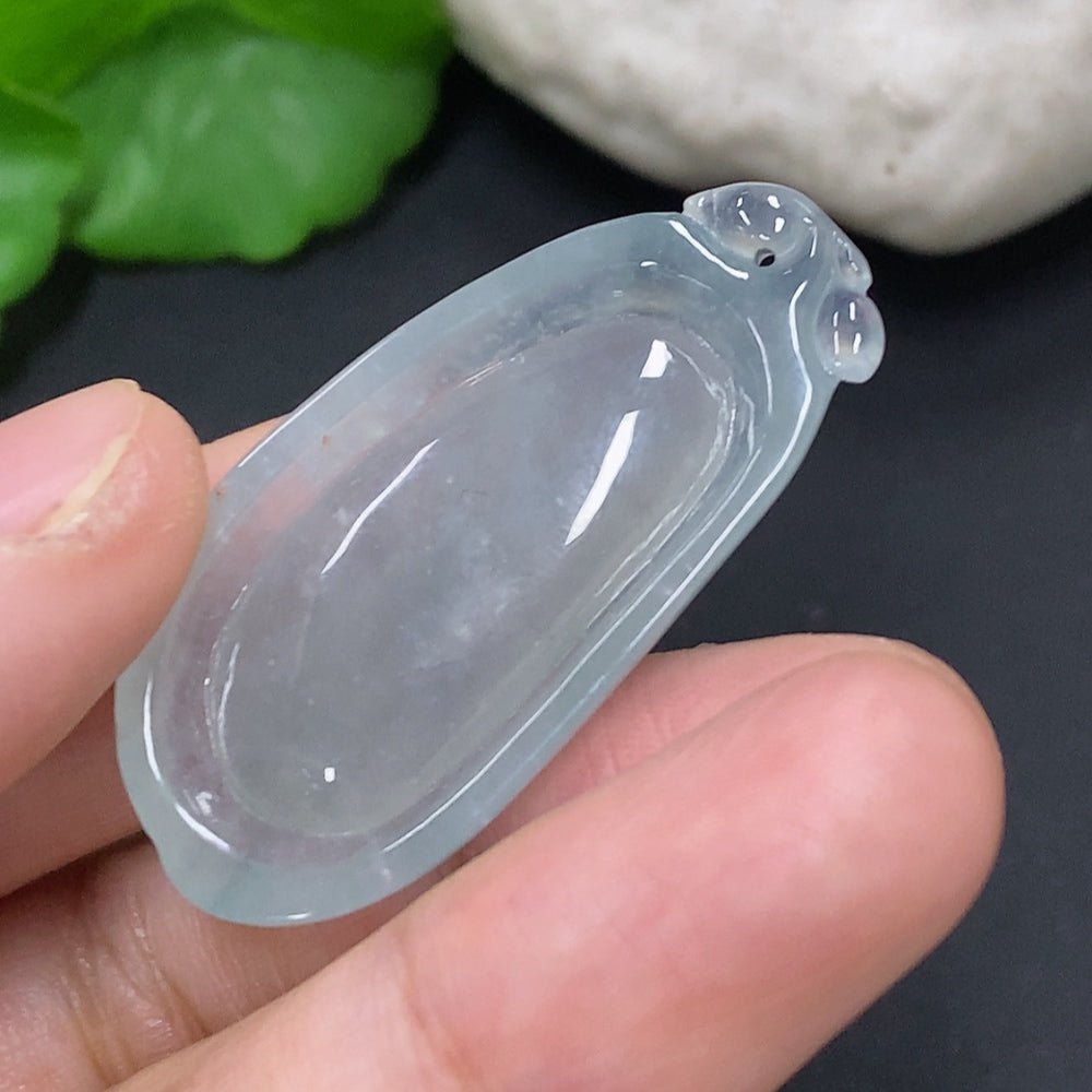 Jadeite gourd pendant from HUILIU HQ featuring an auspicious design, showcasing smooth green jade with intricate carvings.