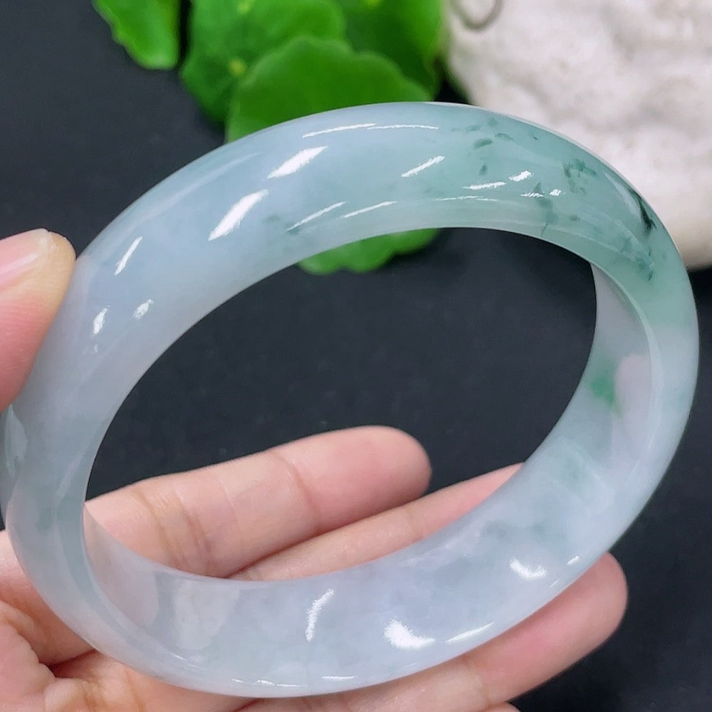 HKHQ jadeite round bangle in size 57.8, showcasing smooth, polished green jade with a glossy finish and elegant round shape.
