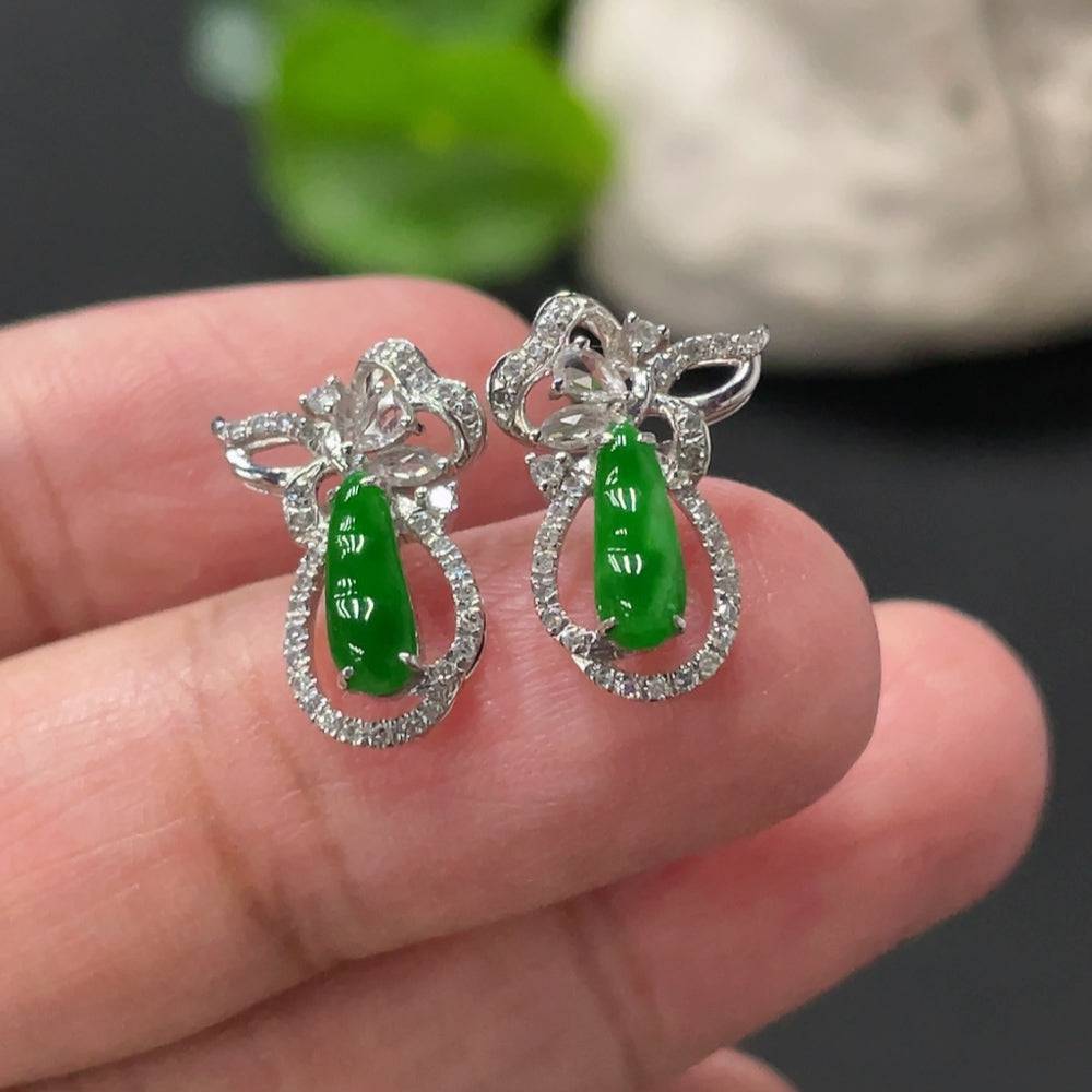 Huiliu Jadeite Lucky Bean earrings pair with small diamond accents, featuring polished jade stones in elegant setting.