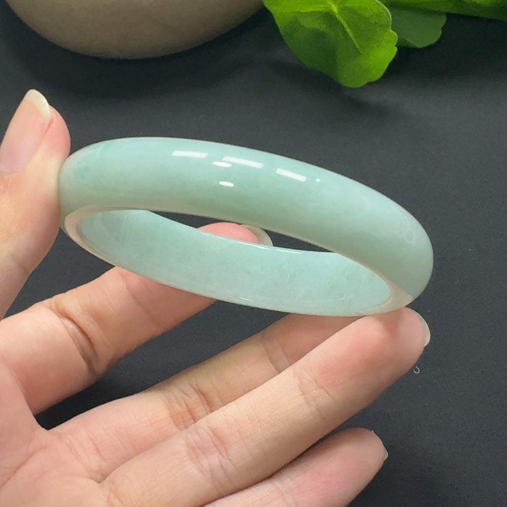 Jadeite round bangle in size 55.8 with approximately 45.69g weight, showcasing smooth, polished green jade from HKHQ.