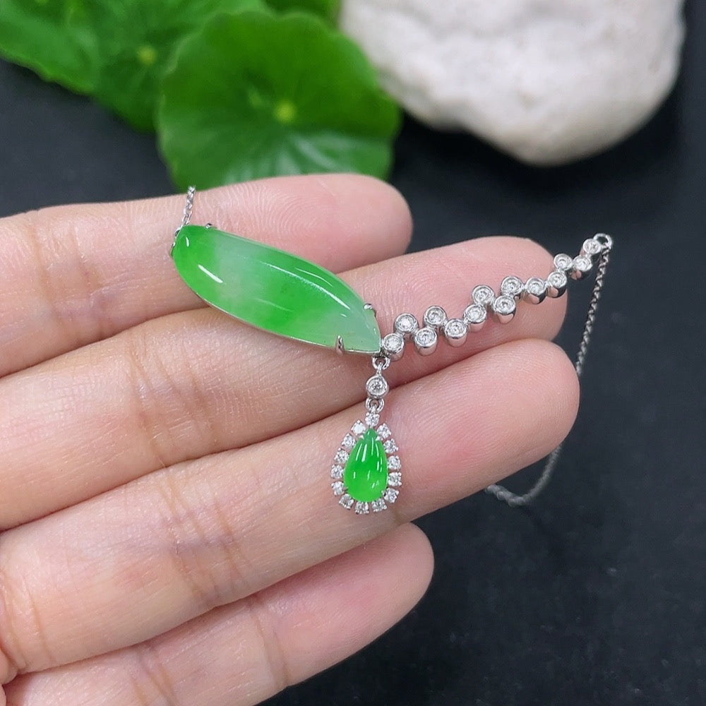 Jadeite pendant necklace with 18K gold and diamond accents, featuring a delicate chain and elegant design.
