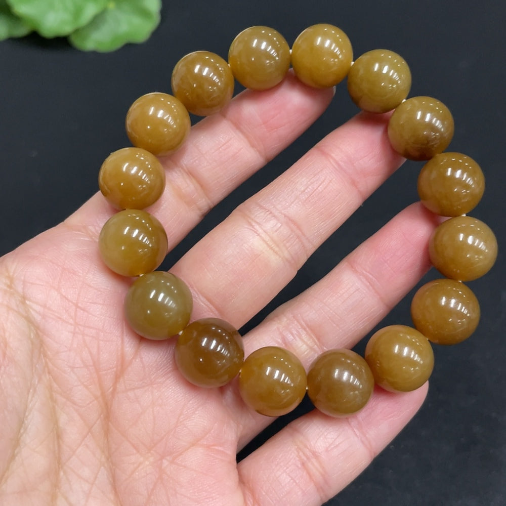 Hetian jade bracelet by HUILIU HQ with 11.6mm beads and a total weight of 42g, showcasing smooth, polished jade stones.