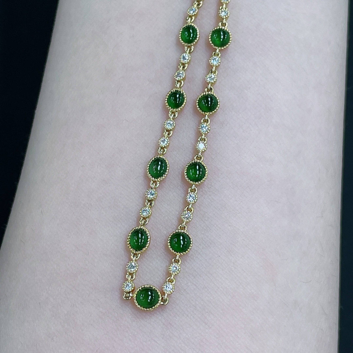 HUILIU HQ jadeite cabochon bracelet with 18k gold inlay and diamond accents, showcasing the elegant jade jewelry design.